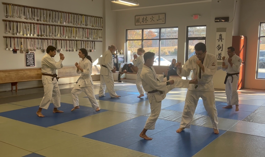 teens in Acworth martial arts class improving focus, discipline, and listening skills through martial arts training