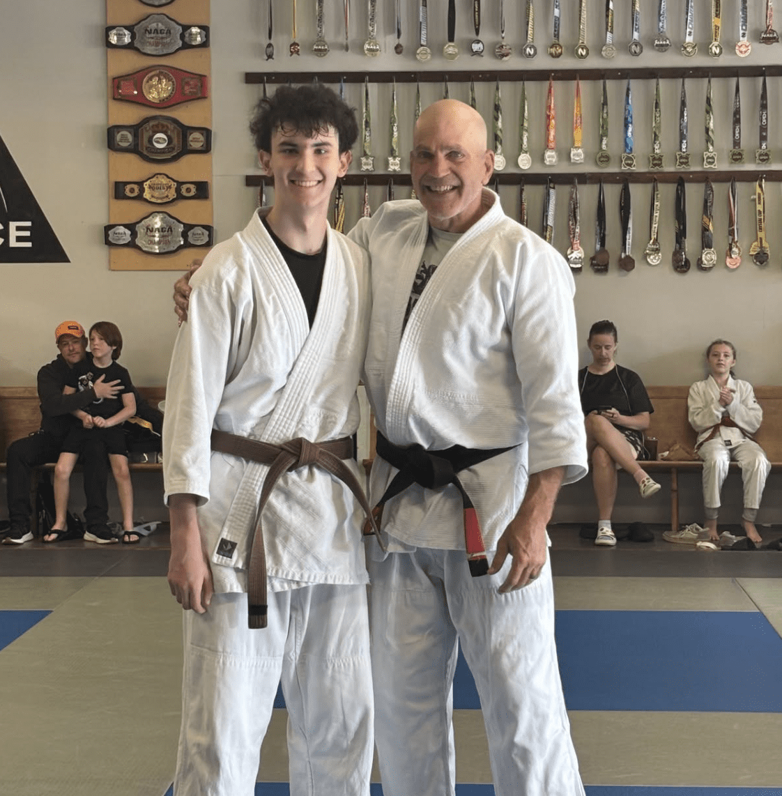 Happy kids in Acworth learning martial arts, improving balance, coordination, and having fun while building life skills.